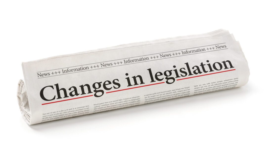 Rolled newspaper with the headline Changes in legislation