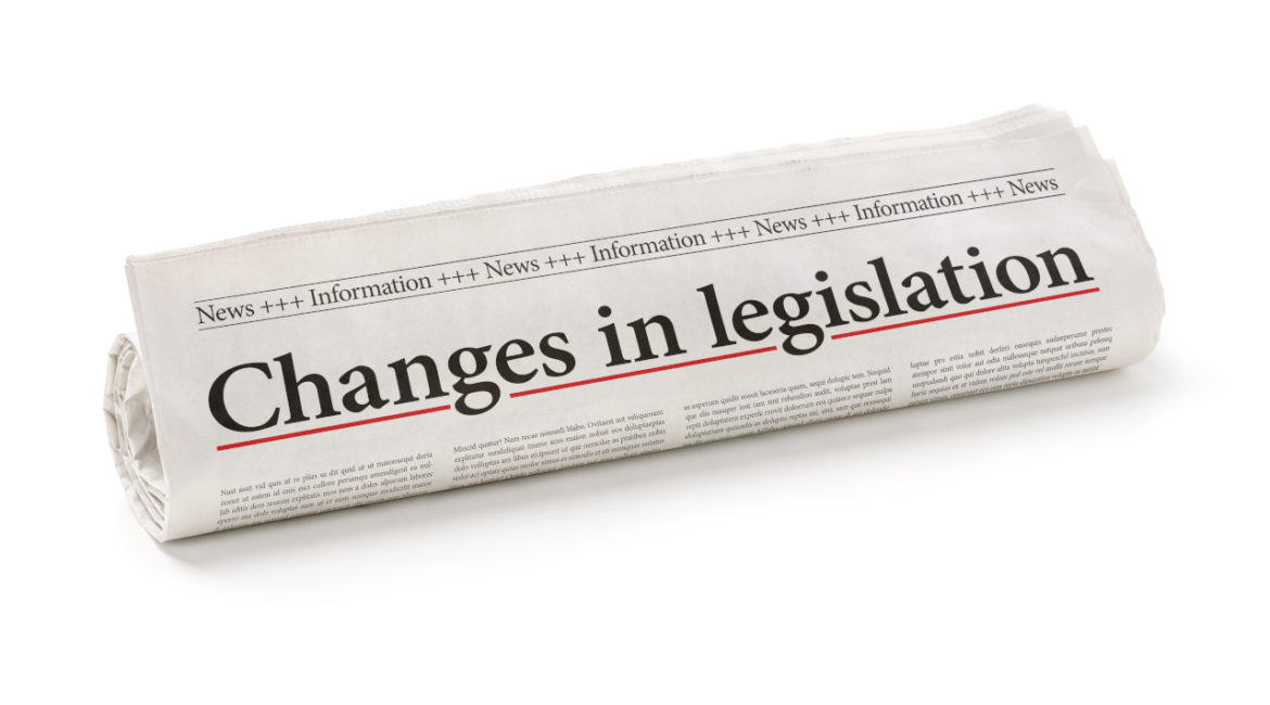 Rolled newspaper with the headline Changes in legislation