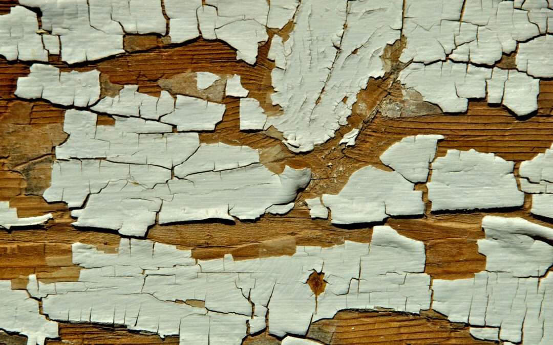 Close up of chipped paint on wood.