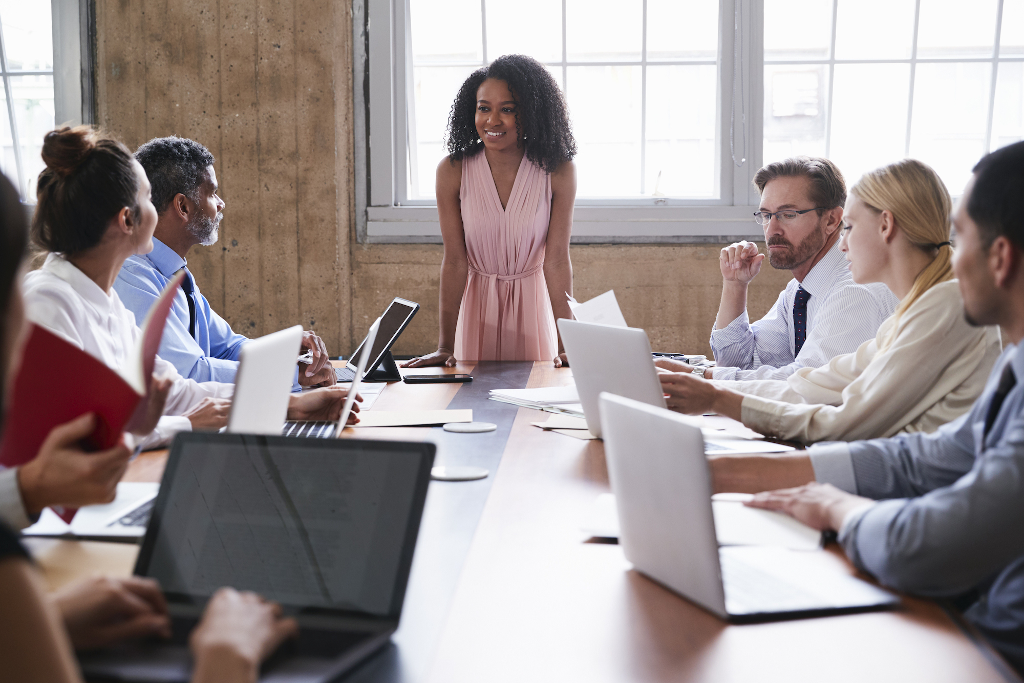 Black businesswoman addressing colleagues at a board meeting