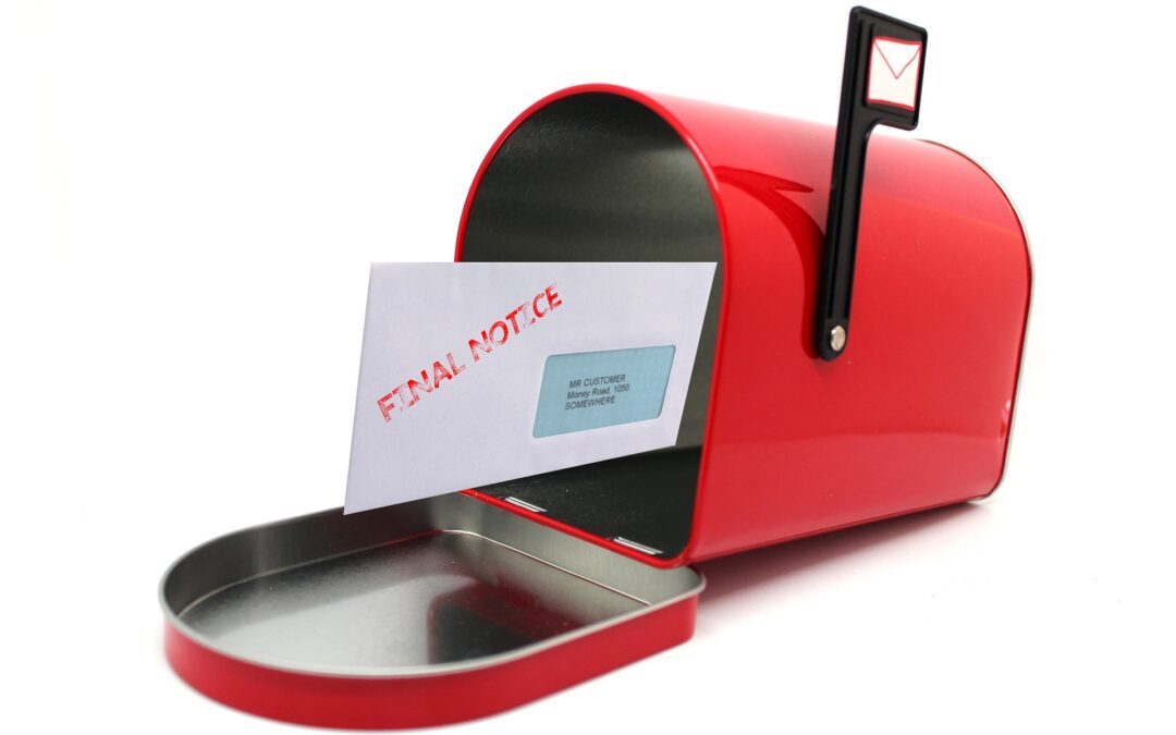 Red mailbox with a letter inside that reads Final Notice