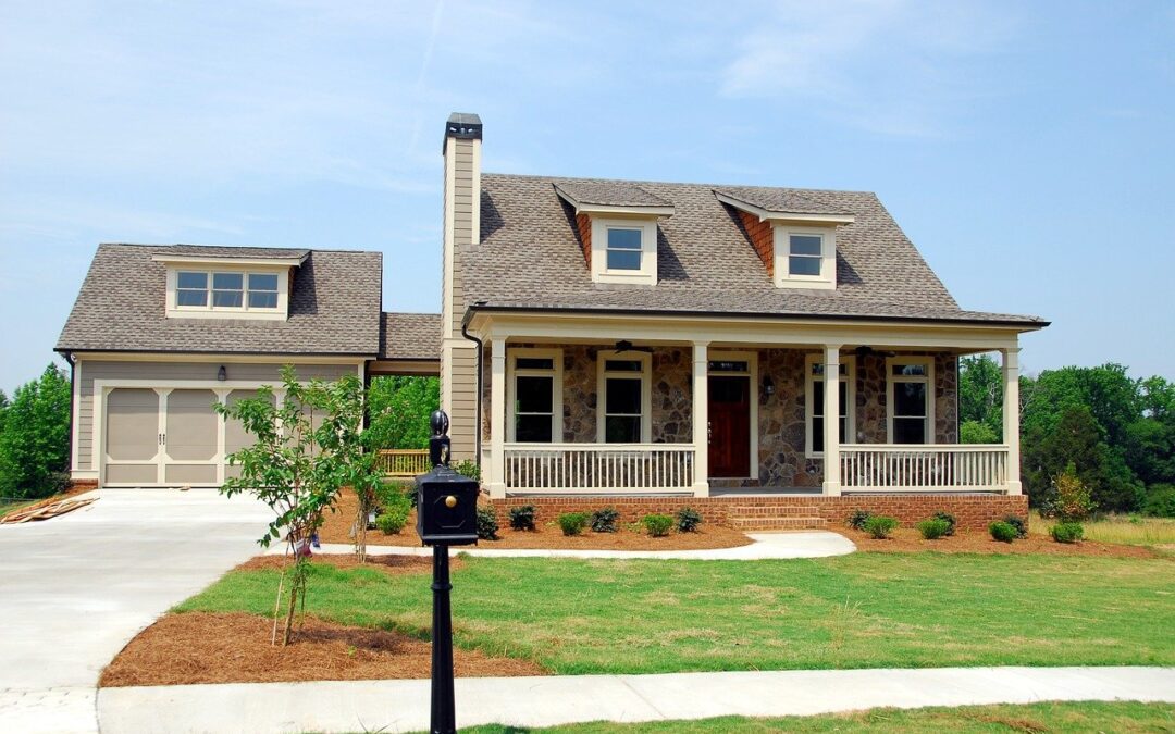 Exterior shot of a luxury home with front lawn and garage